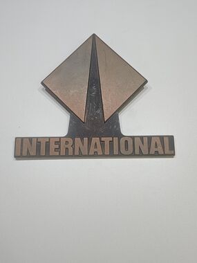 26 International Copper-Tone Raised Logo Truck Emblem